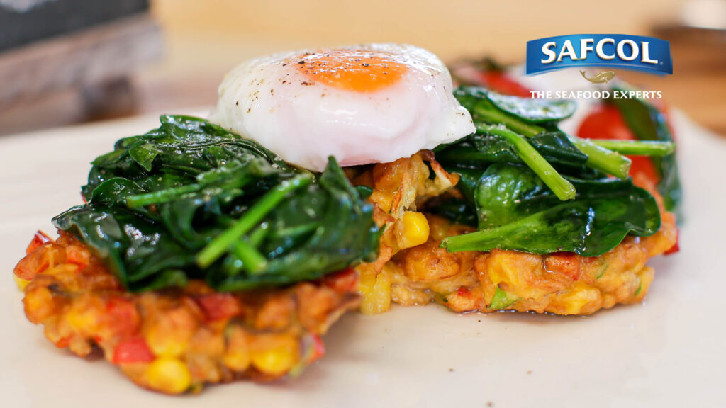 Corn and tuna fritter stack with poached eggs and spinach