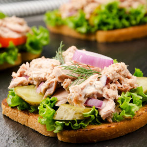 Tuna sandwiches with lettuce tomatoes pickles
