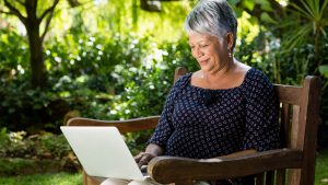 Woman ouside on laptop