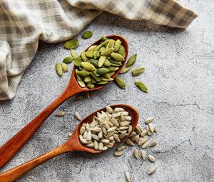  Wooden spoons with sunflower and pumpkin seeds