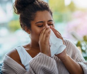 Woman sneezing - Reduce Hay Fever Symptoms